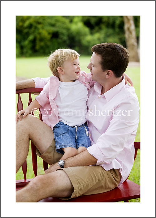 A father and young son have a little chat during a photo session.
